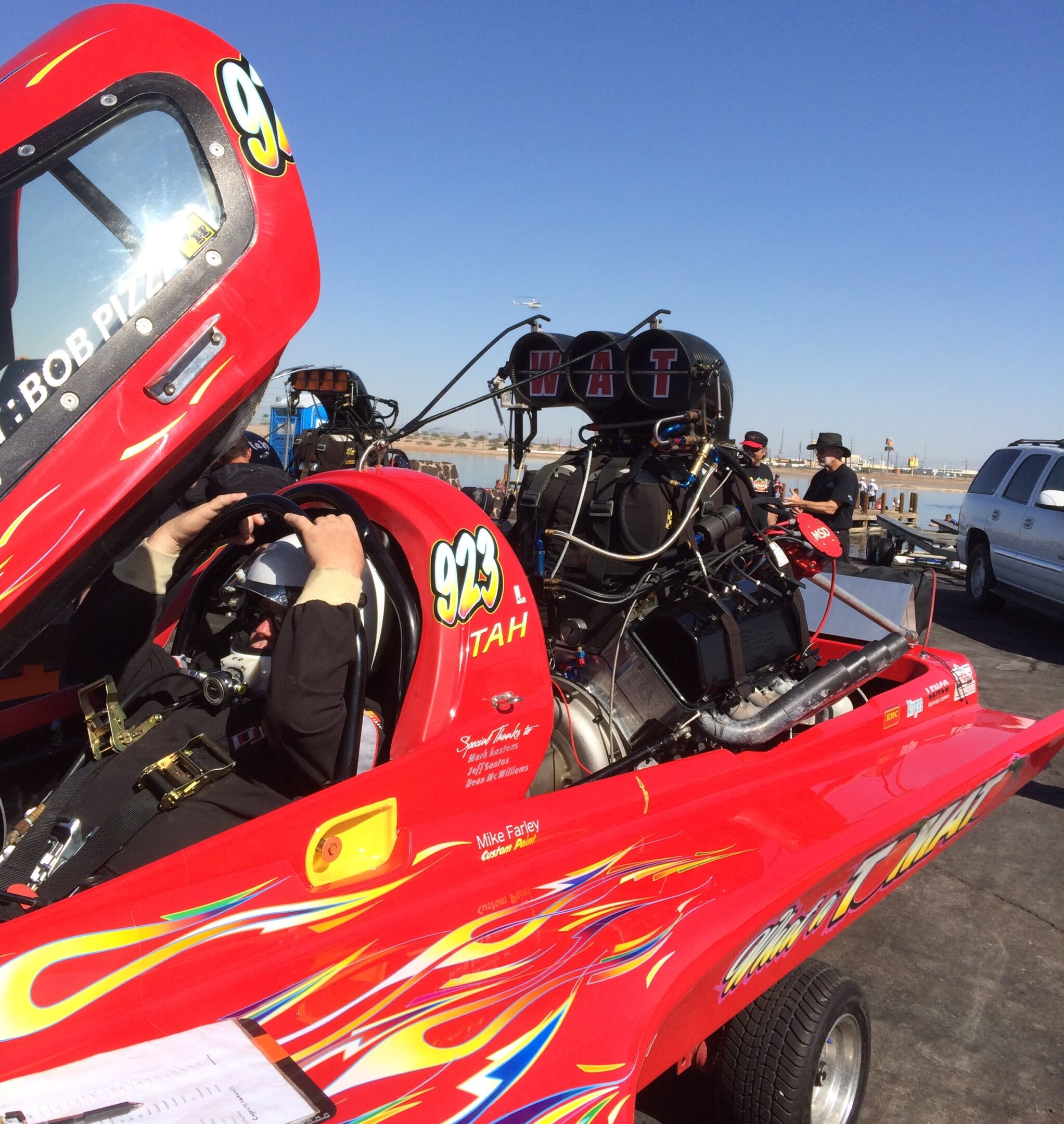 Driver ready in race car cockpit